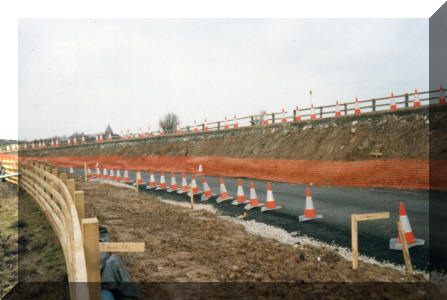 GK - Hawsker New Road with the old road to the right rising up to the bridge